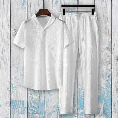 Chic men's summer outfit displayed on a mannequin, featuring a mandarin collar and practical pockets, epitomising casual luxury.