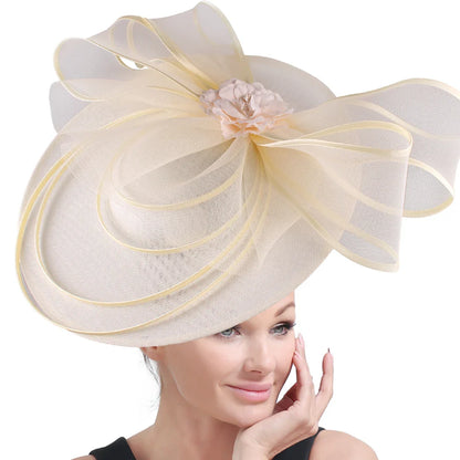 Elegant large fascinator hat for women adorned with floral accents, perfect for cocktail receptions, church services, and lavish party events.