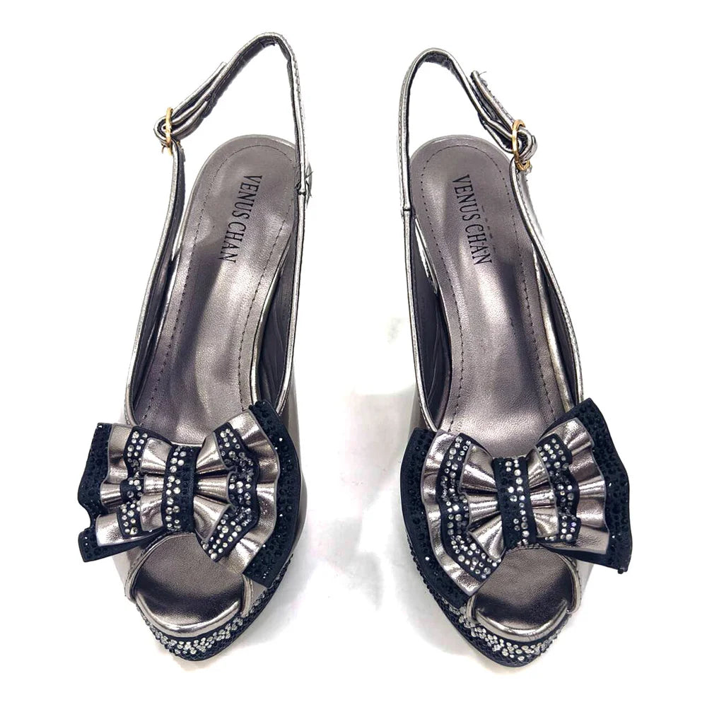 Deluxe green handbag with metal handle matching Venus Chan diamond pumps, designed for women attending upscale occasions.