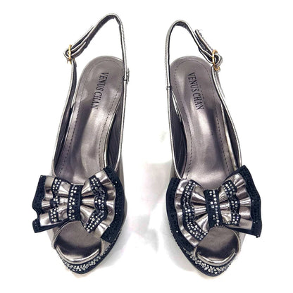 Deluxe green handbag with metal handle matching Venus Chan diamond pumps, designed for women attending upscale occasions.