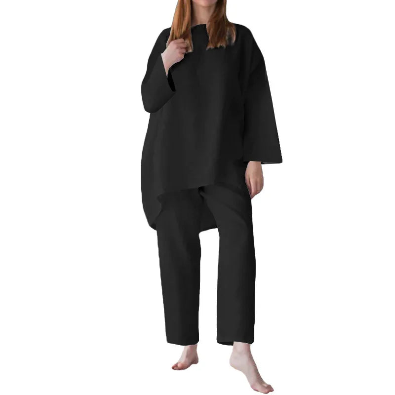 Elegant women's loose-fit short sleeve blouse in classic office style, paired with wide-leg trousers, perfect for spring and summer fashion.