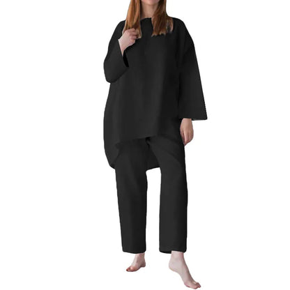 Elegant women's loose-fit short sleeve blouse in classic office style, paired with wide-leg trousers, perfect for spring and summer fashion.