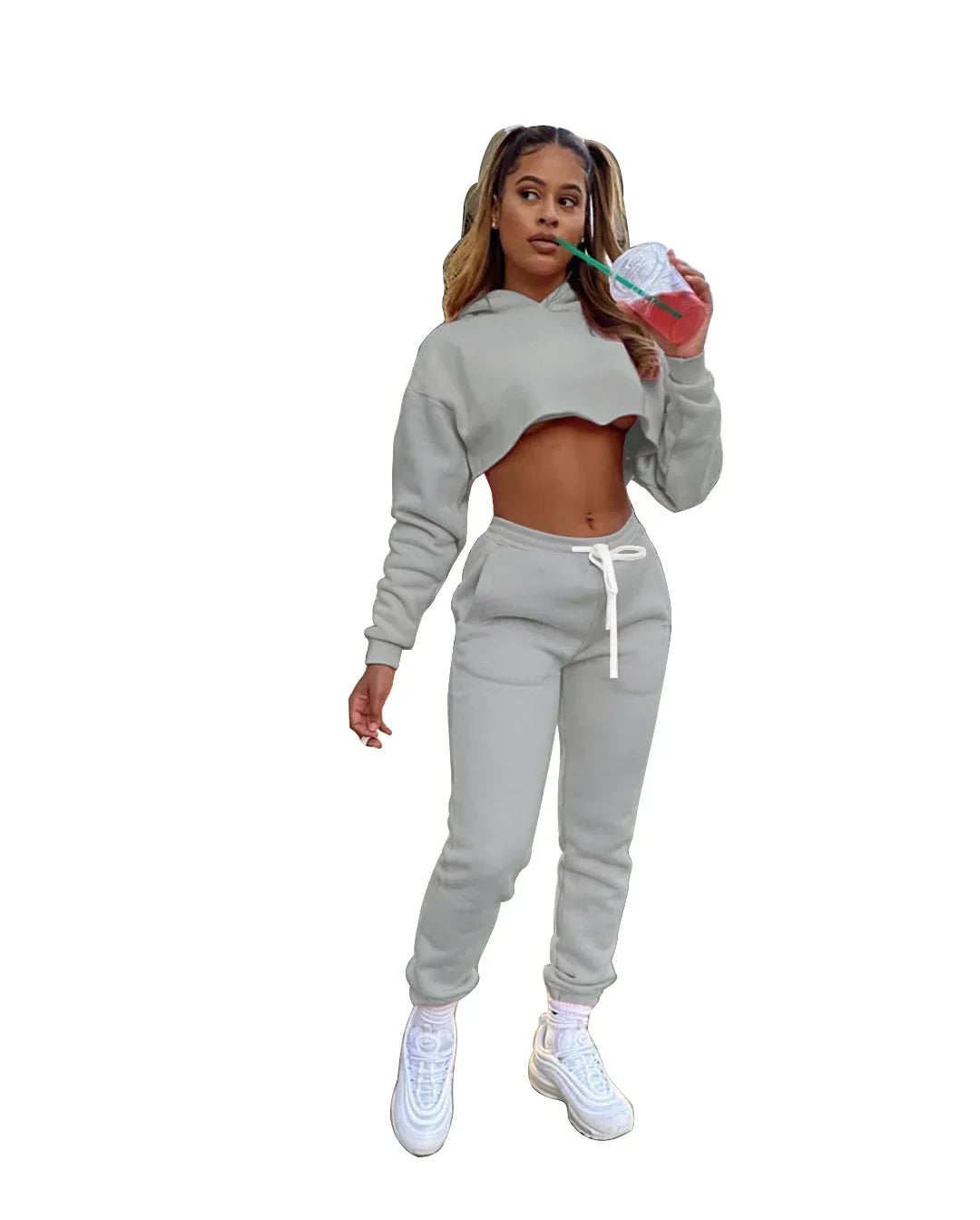 Luxury women's pink fleece running set featuring a stylish long sleeve cropped hoodie and jogger tracksuit with a unique spliced design.