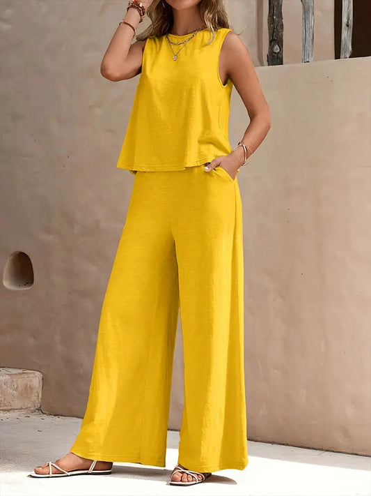 Luxury women's casual sleeveless chiffon top and wide leg pants set, perfect for summer elegance and comfort. Featuring a stylish O-neck design with medium stretch, ideal for a relaxed fit. Made with high-quality rayon and polyester.