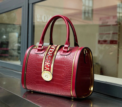 Luxury barrel handbag for women in a sophisticated animal print, combining style with functionality.