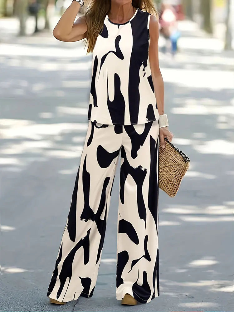 Stylish women's two-piece outfit consisting of a casual sleeveless top and long wide leg pants, designed for comfort and luxury.