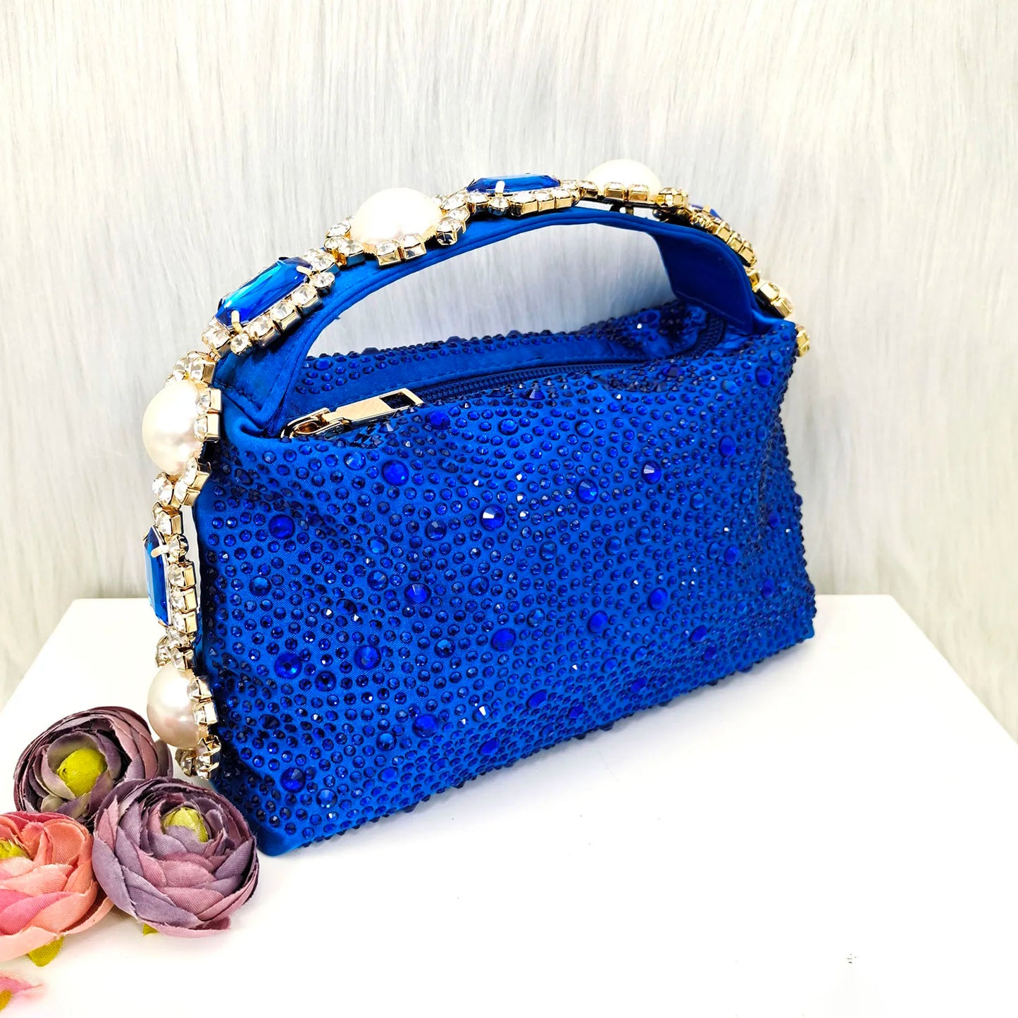 High-fashion blue women's sandals with stiletto heels, embellished with pearls and rhinestones, a must-have for glamourous outings.