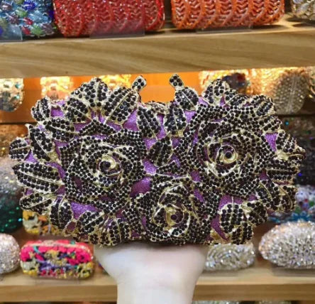 Elegant minaudière clutch with a hard structure and a stunning metallic aesthetic, designed for a fashionable evening look.