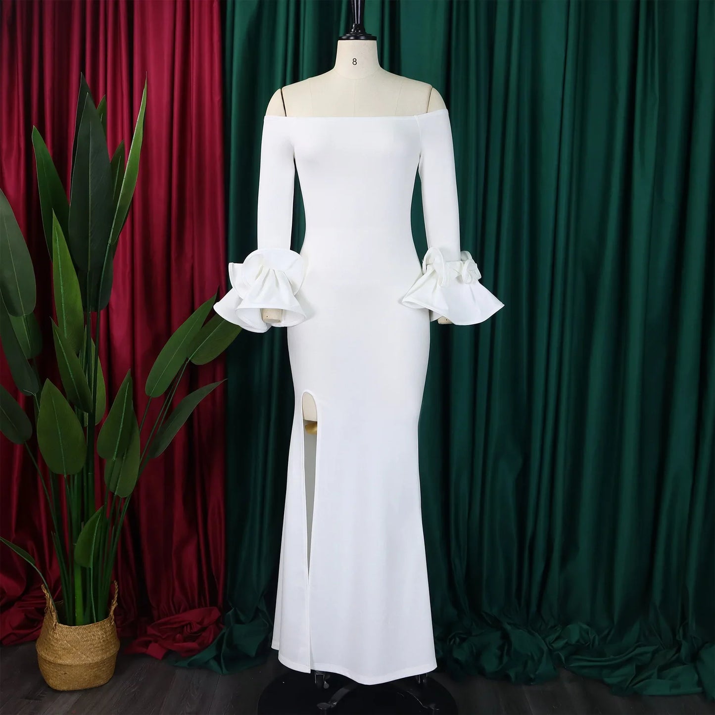 Chic FairyShely Plus Size Off Shoulder Long Sleeve Solid Bodycon Dress displayed on a model, emphasising the floor-length design and modest elegance.