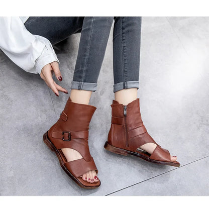 Sophisticated Roman-style flat sandals with a covered heel and side zipper, ideal for chic casual outfits.