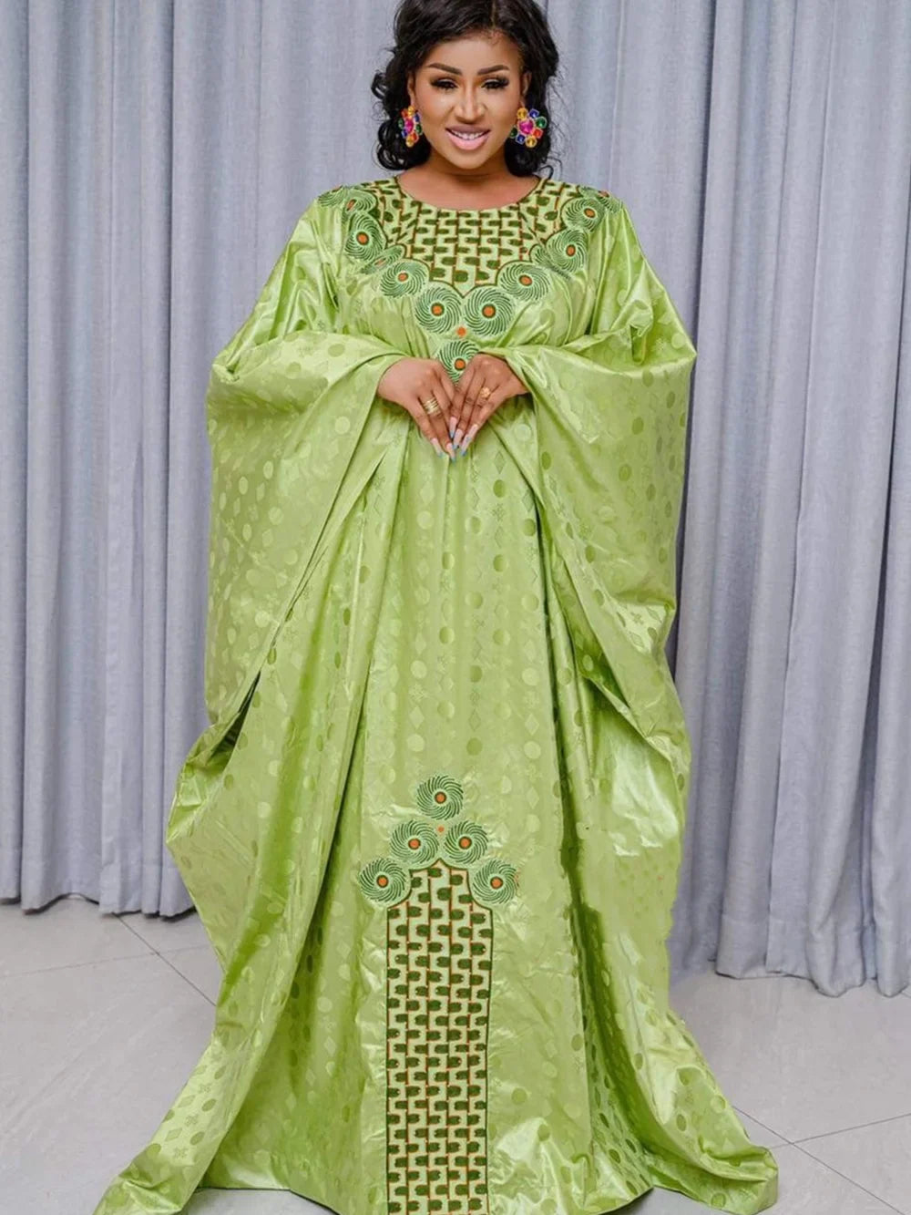 Elegant Traditional African Dashiki Gown for women, showcasing intricate embroidery and vibrant green Ankara fabric, perfect for weddings and upscale parties.