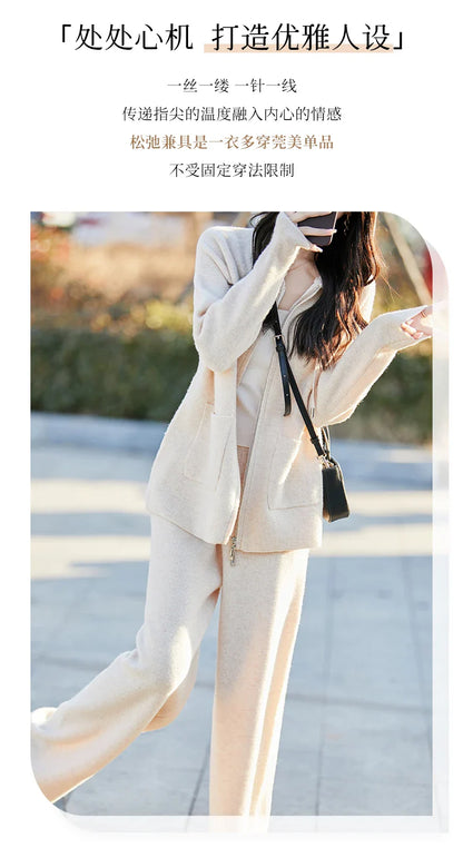 Women’s fashion ensemble featuring a classy hooded cardigan and wide leg pants, crafted from rich Merino wool, providing comfort and style.