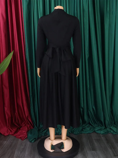 Sophisticated knee-length plus size dashiki dress in a stunning African print, ideal for parties and gatherings.