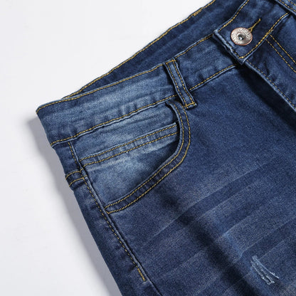 Elegant men's fashion with distressed details on premium skinny jeans, crafted from high-quality stonewashed denim for a trendy casual look.