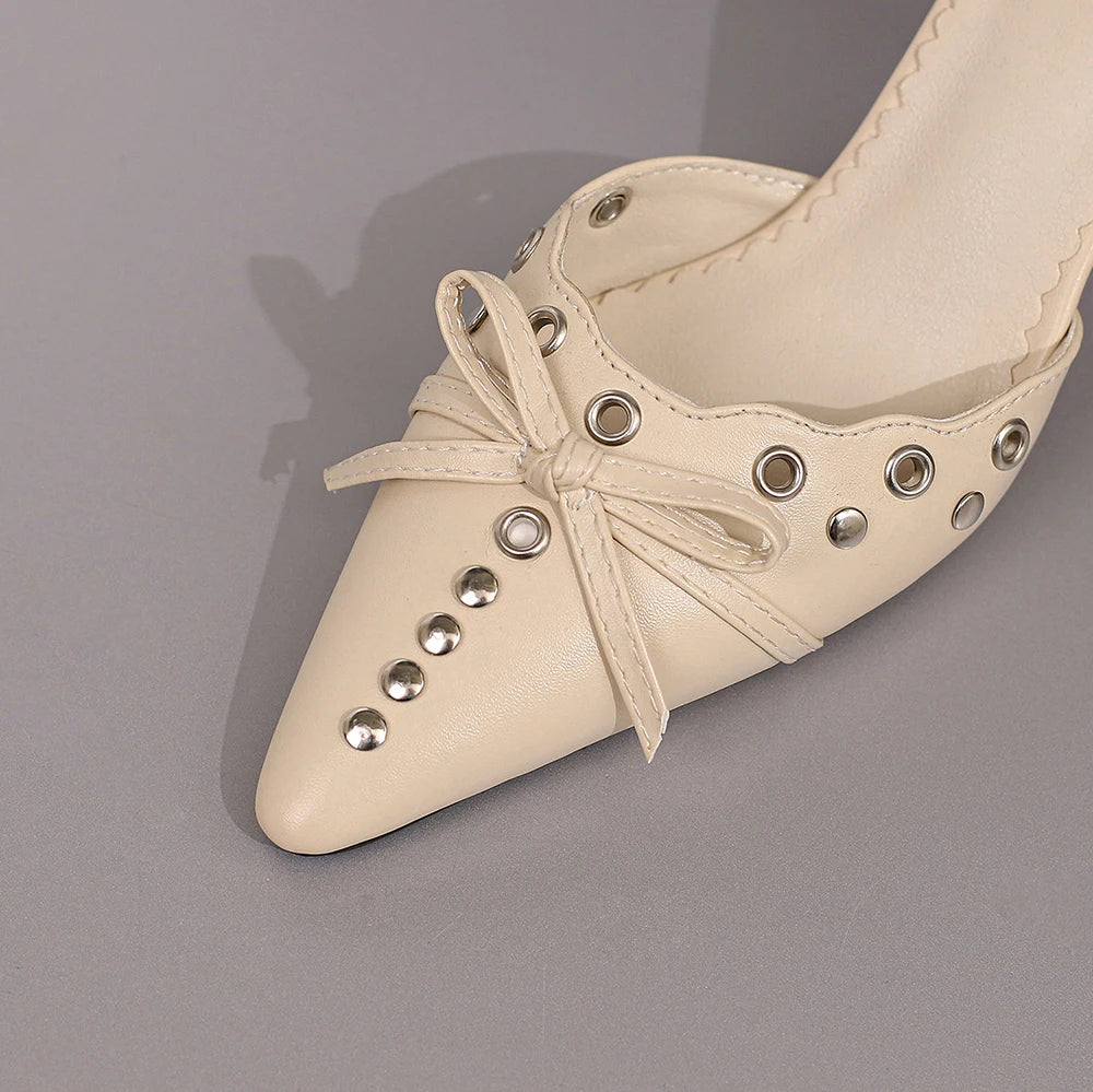 Elegant slip-on luxury sandals for women showcasing a delicate d'Orsay style and unique metal decoration, ideal for special occasions.