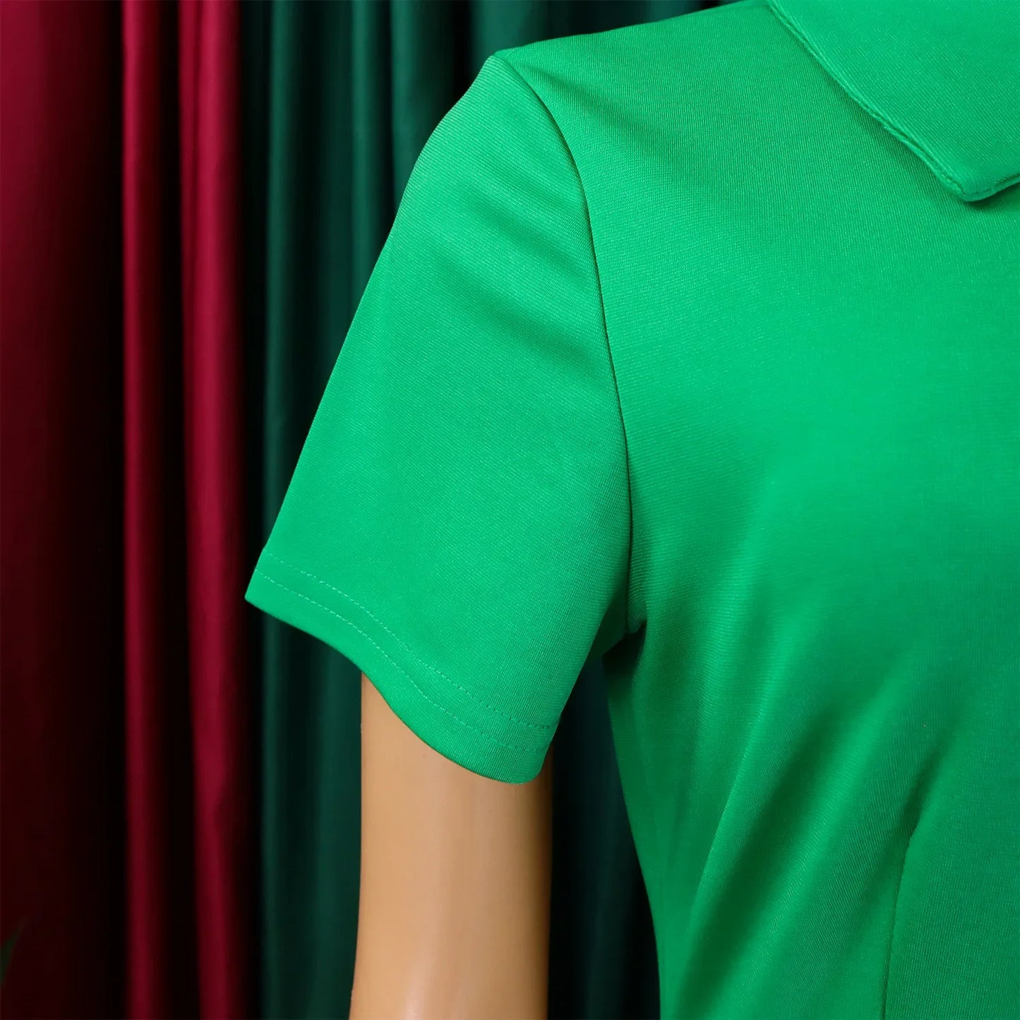 Luxurious knee-length evening dress for women featuring exquisite pleats and classic Peter Pan collar, designed for a refined look.