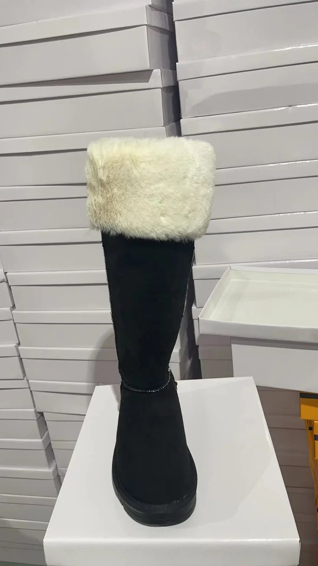 Elegant Women's Winter Snow Boots featuring plush warm lining, a stylish mid-calf design made from luxurious fur and durable rubber insoles for optimum comfort and cold-proof functionality.