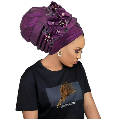 Luxurious African women's turban cap featuring a stunning diamond flower embellishment for elegant style.