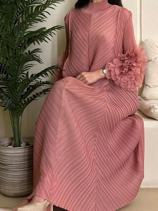 Elegant pleated maxi dress featuring petal sleeves and a half turtleneck, perfect for formal occasions.