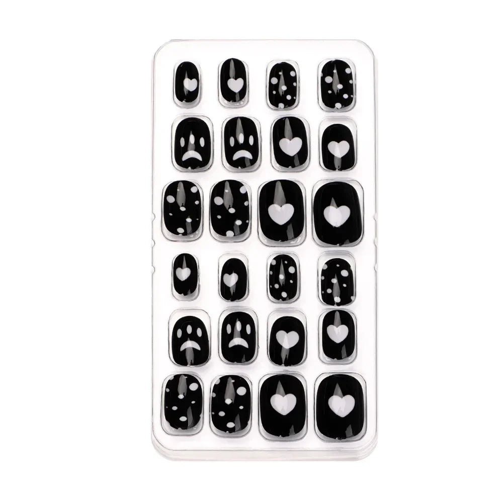 Elegant display of 24 pieces of acrylic press-on false nails for kids, featuring a charming candy flower design, perfect for enhancing youthful nail decoration.