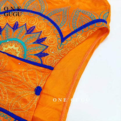 Luxurious elegant orange Bazin dress adorned with intricate embroidery lace, designed for women’s traditional Dashiki style, perfect for weddings and festive parties.