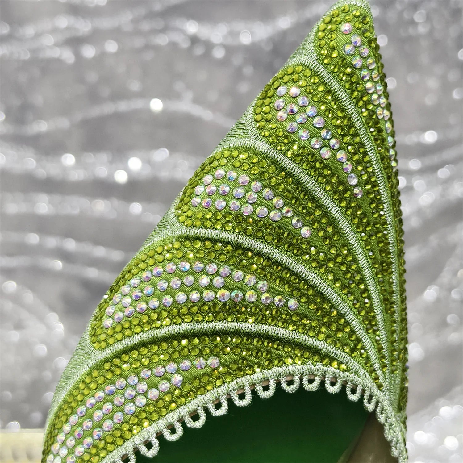 Stylish women’s pump shoes with a pointed toe and spike heel, adorned with diamond accents, designed for sophistication and comfort.