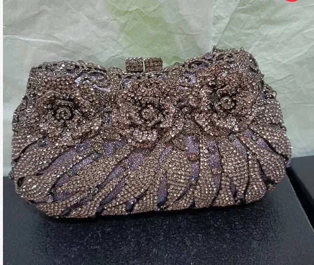 Chic metallic evening clutch bag, featuring a sophisticated hard exterior and elegant hasp closure, ideal for special occasions.