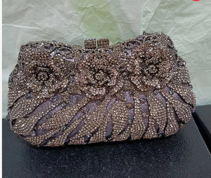 Chic metallic evening clutch bag, featuring a sophisticated hard exterior and elegant hasp closure, ideal for special occasions.