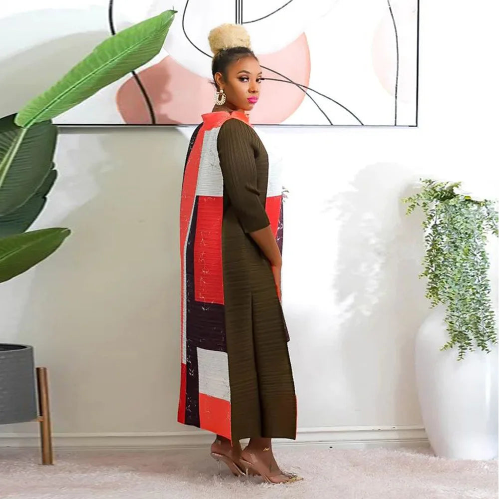 Stylish African Kanga clothing for women, with a delicate 3/4 sleeve design and vibrant colours, ideal for formal occasions.