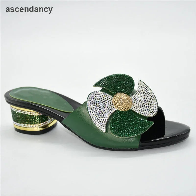 Elegant women's mid-heeled slip-on sandals adorned with rhinestones, showcasing a refined round toe design, perfect for luxurious summer occasions.