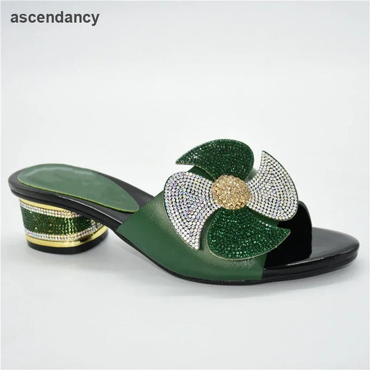 Elegant women's mid-heeled slip-on sandals adorned with rhinestones, showcasing a refined round toe design, perfect for luxurious summer occasions.