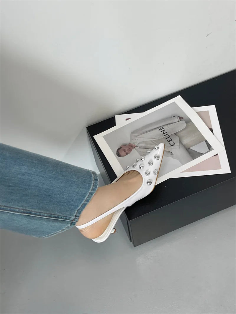 Sophisticated pointed toe back strap pumps in PU material, showcasing a modern and fashionable look for women.