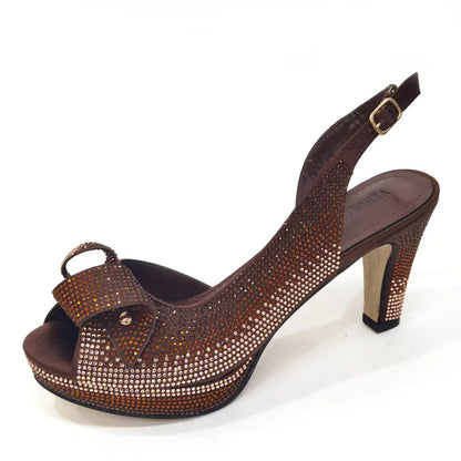 Chic Venus Chan matching peach bag with a sleek metal handle, elegantly designed for women, complementing high heels for a stunning ensemble.