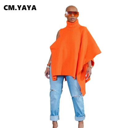 Model wearing the CM.YAYA Women's One Long Sleeve Asymmetrical Turtleneck Pullover in a fashionable urban setting, highlighting its loose fit and trendy silhouette.