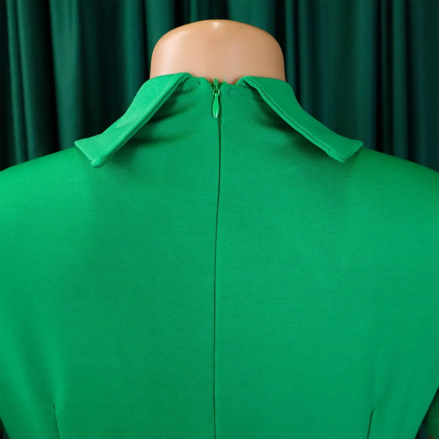 Elegant women's high-waisted pleated knee-length evening dress showcasing a sophisticated Peter Pan collar, perfect for formal occasions.