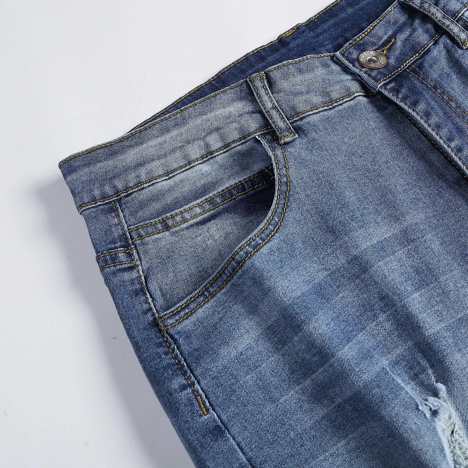 Luxury Men's Ripped Skinny Jeans in Vintage Stonewashed Denim, showcasing a sleek and stylish casual slim fit.