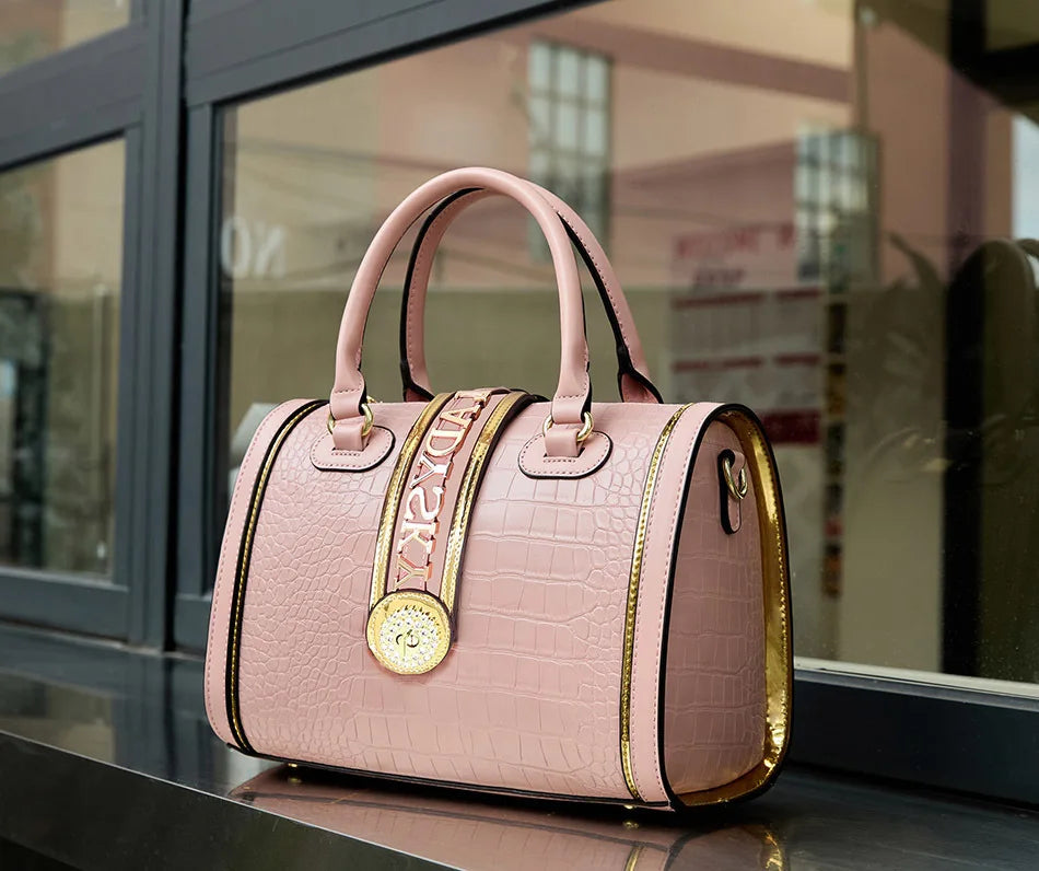 Luxurious women's Boston barrel handbag in soft microfiber leather, featuring an eye-catching animal print design.