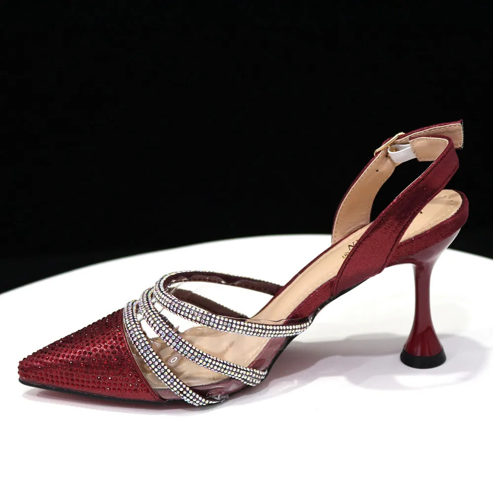 Exquisite matching bag set featuring a stylish metal handle and long chain strap, complementing Venus Chan black heels.