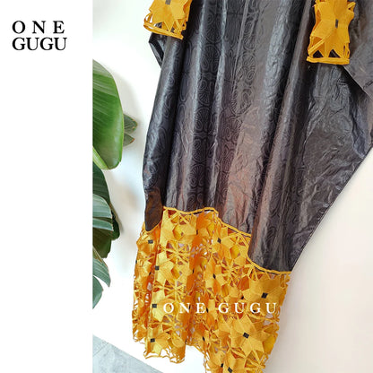 Model wearing luxurious gold and white African dress robe, highlighting its elegant design and comfortable fit for stylish women.