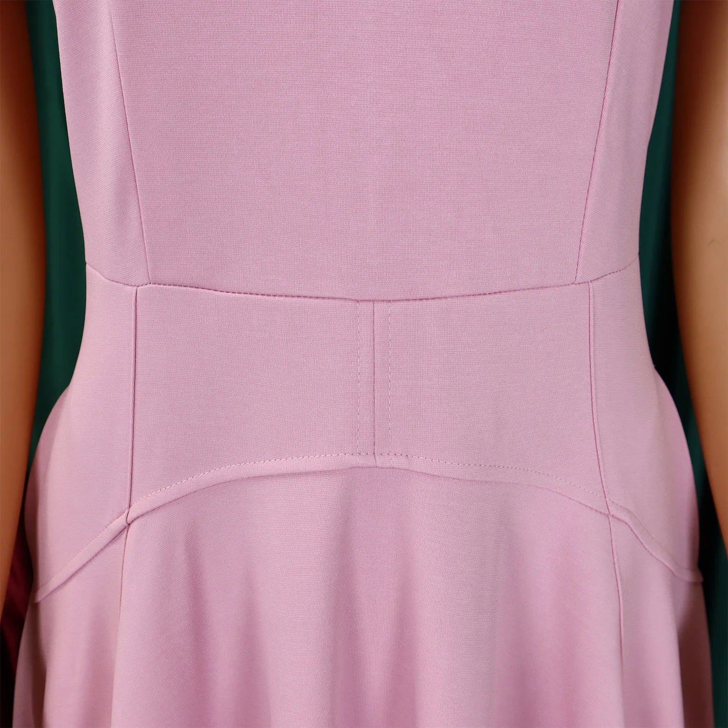 Close-up detail of the luxurious fabric of the high-waisted evening dress, showcasing its soft polyester blend and fine pleating.