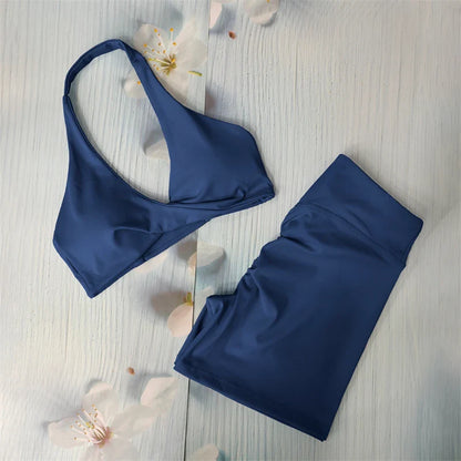 Elegant woman wearing a butt lifting yoga shorts set, showcasing a flattering cross waist design ideal for active lifestyles and workouts.