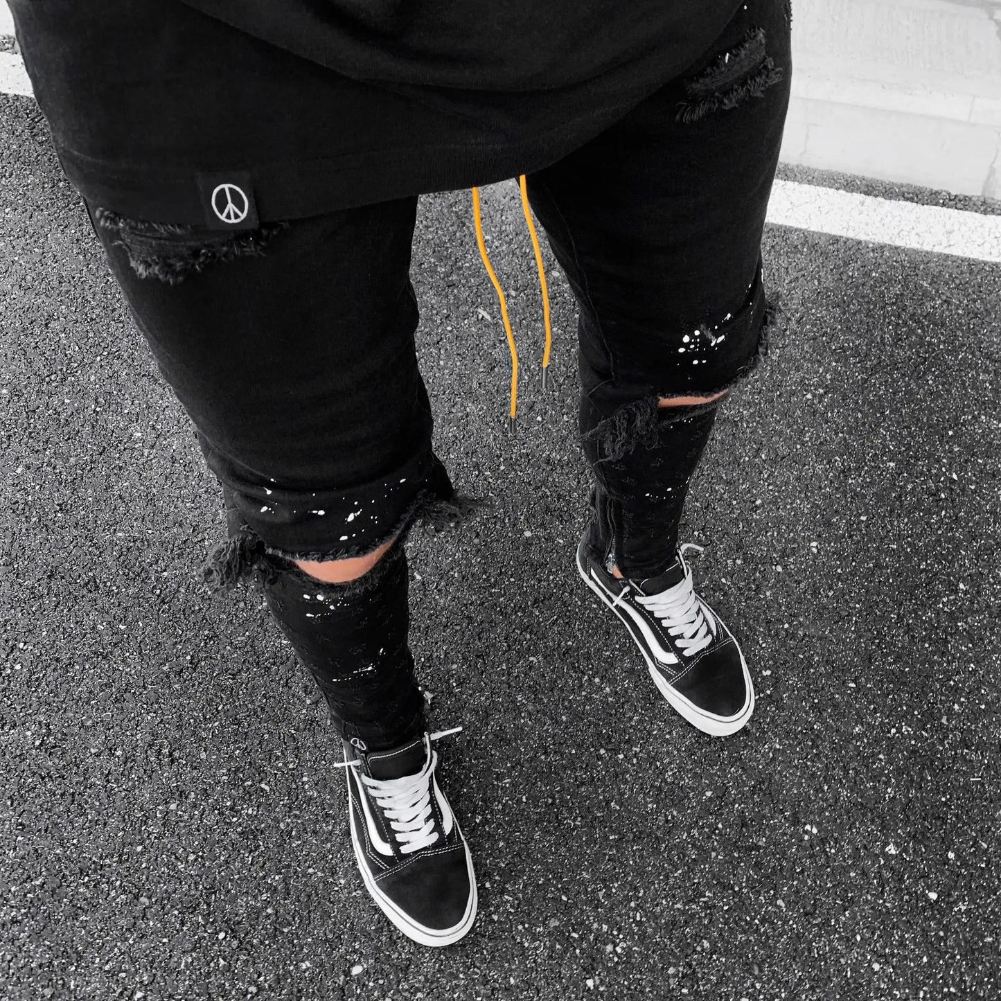 Luxurious Ripped Hole Jeans for Men showcasing a trendy hip hop style, crafted from premium denim for a distressed look ideal for casual occasions.