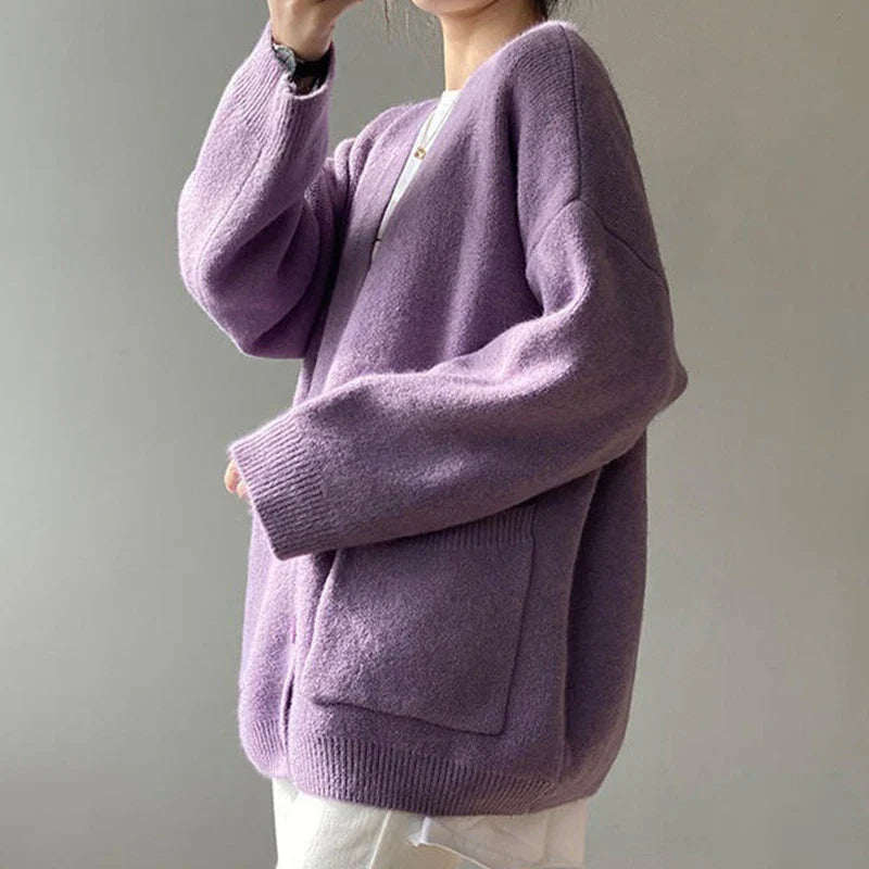 Stylish loose-fit yellow cardigan crafted from a comfortable blend of polyester and cotton, perfect for layering in cooler seasons.