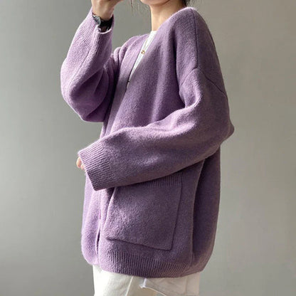 Stylish loose-fit yellow cardigan crafted from a comfortable blend of polyester and cotton, perfect for layering in cooler seasons.