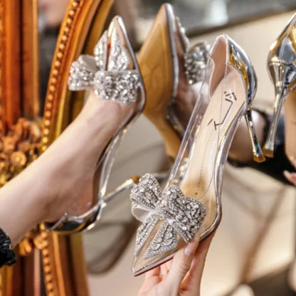 Luxurious women's transparent high heels featuring a dazzling diamond bow, pointed toe design, and super high 8cm stiletto heels, perfect for glamorous party occasions.