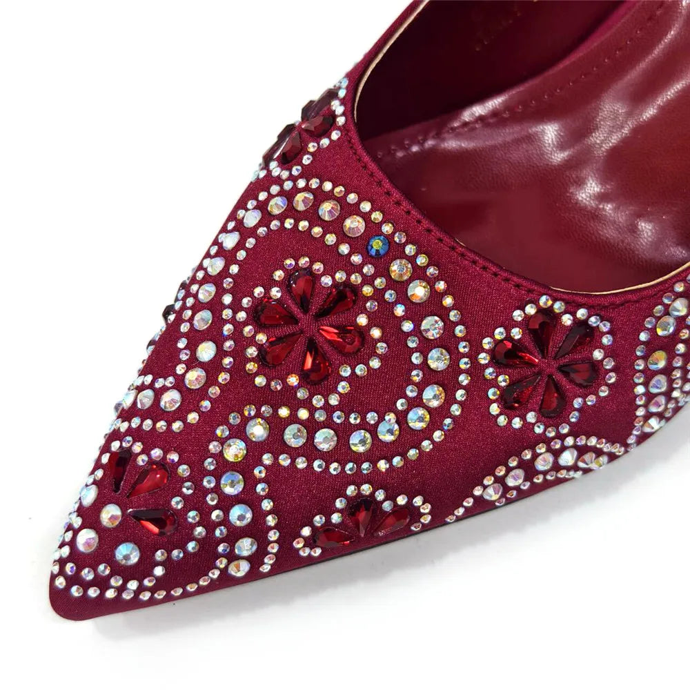 Close-up of luxurious fuchsia pumps showcasing rhinestone detailing and comfortable high heel.