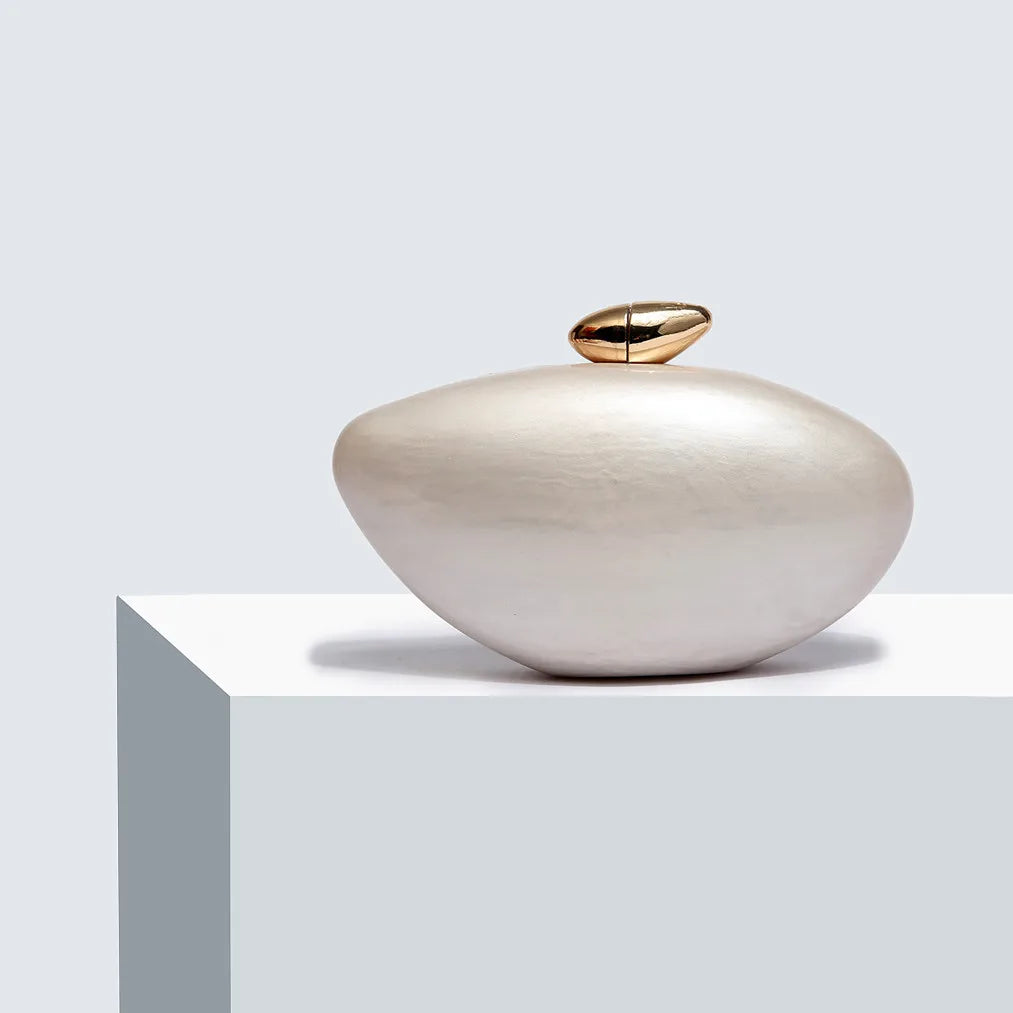 Chic and elegant minaudiere evening bag, ideal for enhancing formal attire at weddings and evening parties.