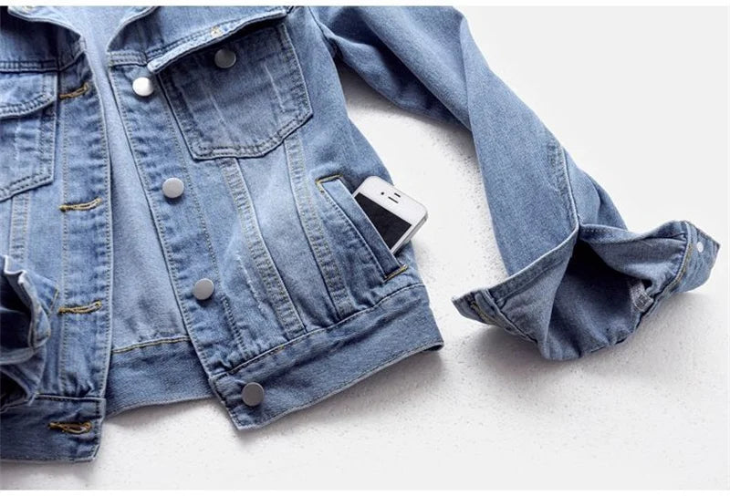 Elegant women's denim jacket with pockets, exemplifying timeless casual luxury and versatility.