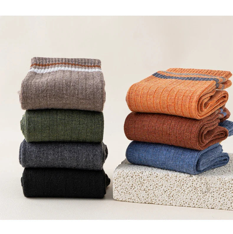 Men's comfortable and fashionable mid-tube socks, crafted for durability and a snug fit during winter sports.