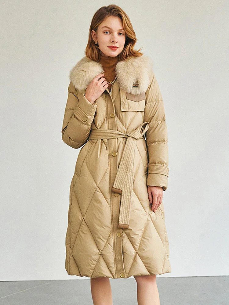 Luxury women's long duck down jacket in elegant black, featuring a detachable real fox fur collar for ultimate style and warmth during winter.